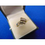 A 10ct Gold Diamond cross over ring