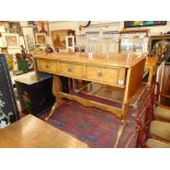 A sofa table with three drawers