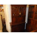 A Mahogany bookcase on cupboard base