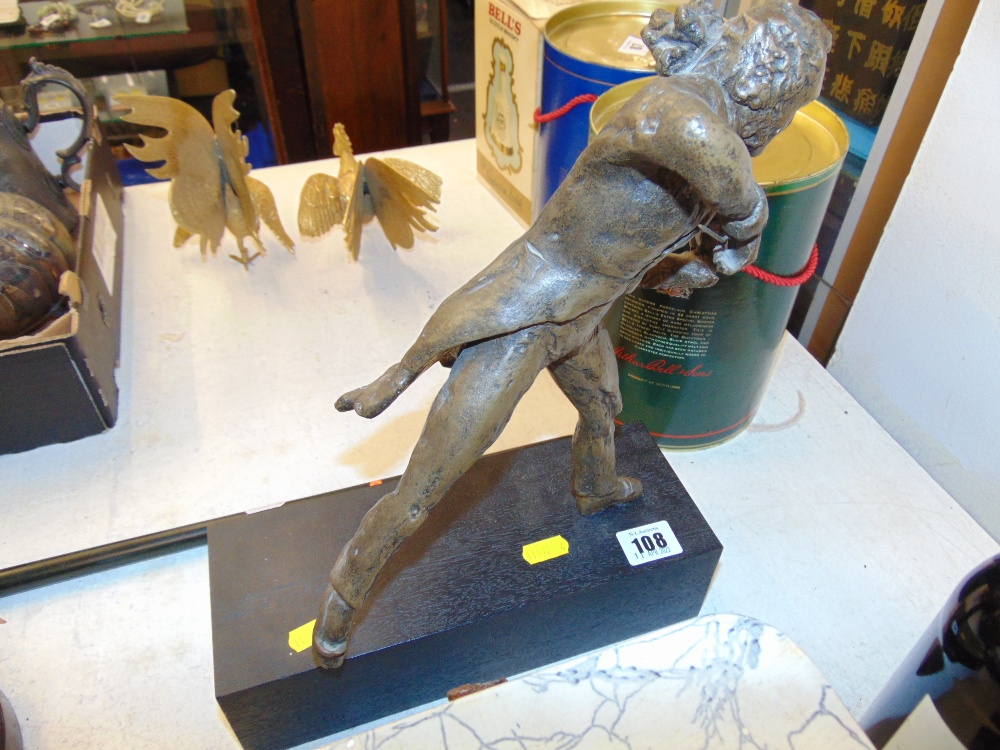 A figure of a violinist on base