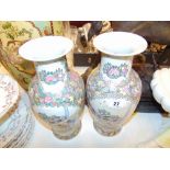 A pair of small Canton style vases