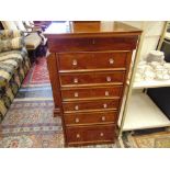 A Wellington style chest of six drawers,