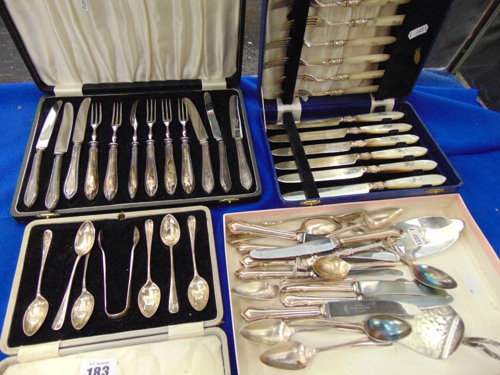 A boxed set of hallmarked silver spoons, tongs, boxed sets of cutlery etc.