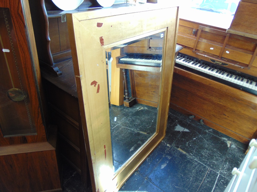 A gilt over mantle mirror