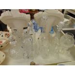 A collection of decanters, glass bells etc.