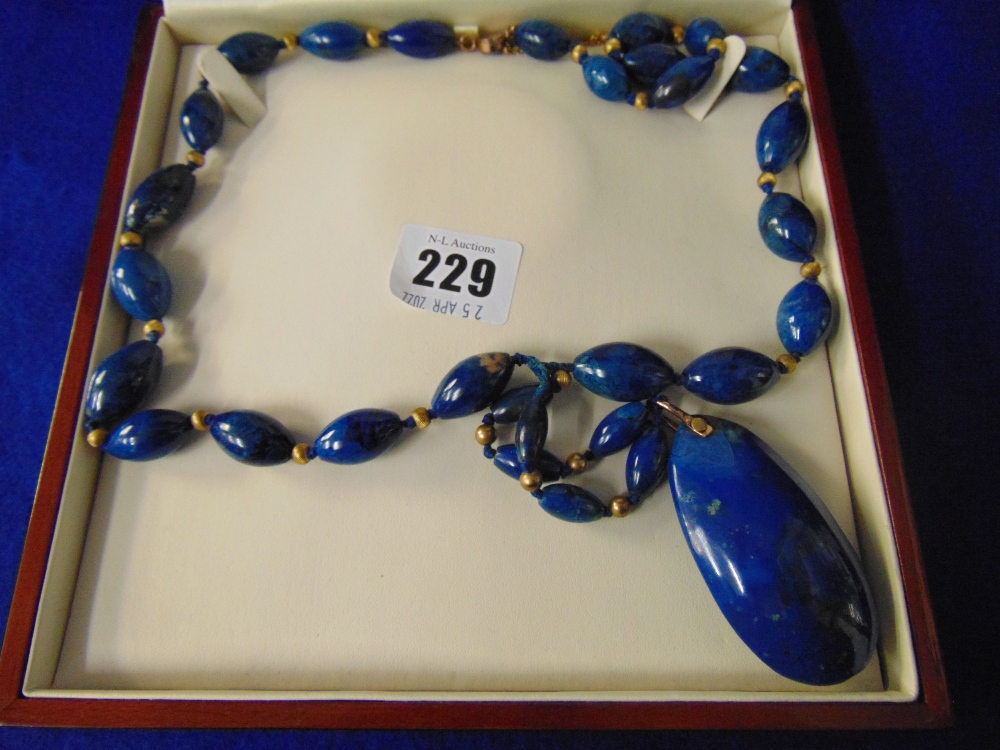 An Artdeco Imperial Lapis Lazuli necklace set with Pearl and with gold beads and clasp