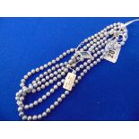 A set of three grey Pearl necklaces,