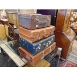 Four suitcases and a fitted instrument case