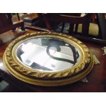 An Oval gilt mirror