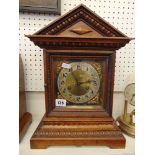 A brass framed mantle clock