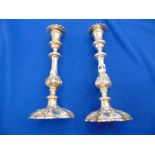 Two hallmarked Silver plated Georgian candlesticks,