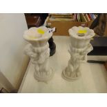 A pair of marble candlesticks