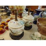 A pair of Chinese porcelain lidded pots, converted into lamps on stands, possible late 19th century,