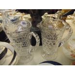 A pair glass jugs,