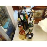 Nine bottles alcohol; Port, Sherry, Bells, Harvey's,