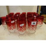 Twenty three Red overlay glasses