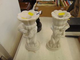 A pair of marble candlesticks