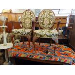 An Oval Mahogany dining table and five chairs,