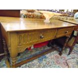 An Oak hall table with two drawers