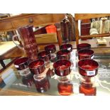 A Cranberry Red jug and ten glasses