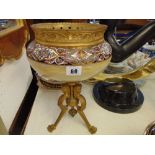 An enamel/ marble bowl/ tripod base