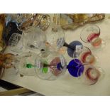 A set of six coloured Hock glasses and three Sherry