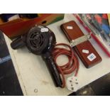 A Bakelite hair dryer and a tie press