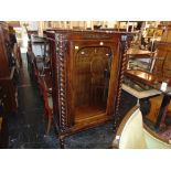 A Mahogany glass fronted cabinet with marble top