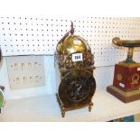 A brass lantern clock