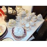 A floral pattern tea set plus others including some Crown Derby