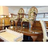 An Oval Mahogany dining table and five chairs,