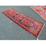 A Ghash-ghaie Persian runner, red ground,