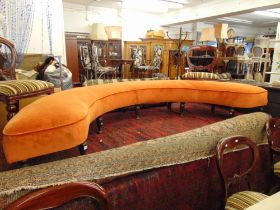 A curved upholstered window seat