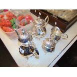 A silver plated tea set; teapot,