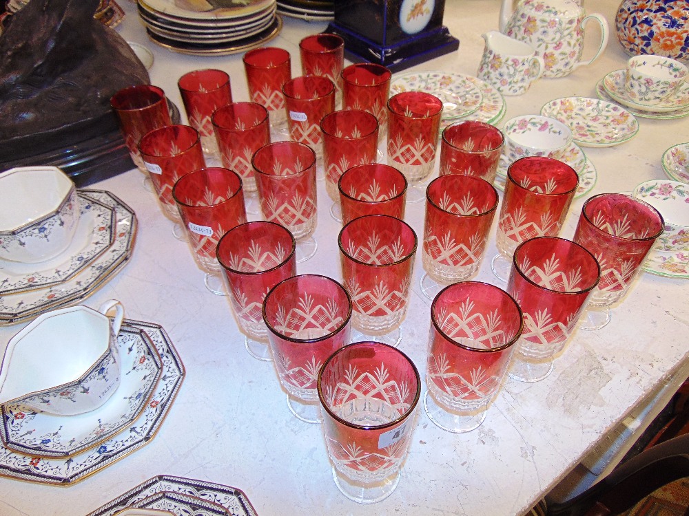 Twenty three Red overlay glasses