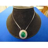 A Cabochon Emerald pendant on 18ct White gold chain, Emerald approx.