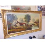 A gilt framed landscape oil signed