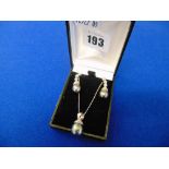 A Black Pearl necklace and earring set on 18ct White Gold