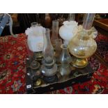 Seven assorted oil lamps