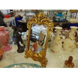 An ornate gilt art nouveau free standing mirror