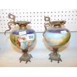 A pair of small blue oil lamps a.