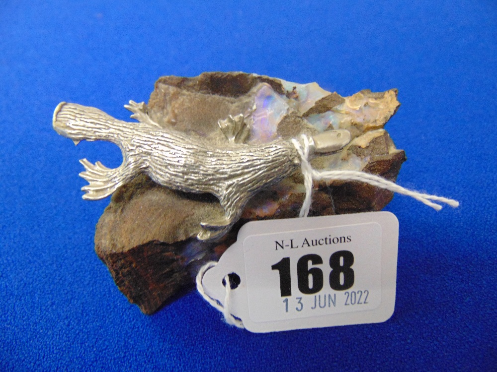 An Australian bolder Opal with a Silver Duck Bill Platypus