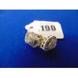 An 18ct Yellow and White Gold earrings set with bagette and brilliant cut Diamonds, approx.