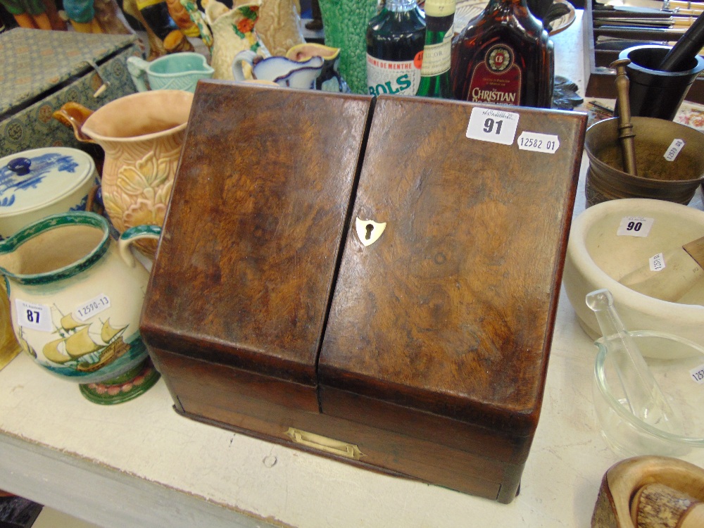 A Walnut stationary cabinet