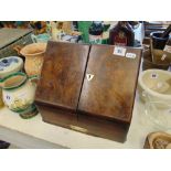 A Walnut stationary cabinet