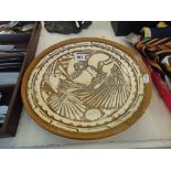 An Arts and Crafts style pottery charger a.