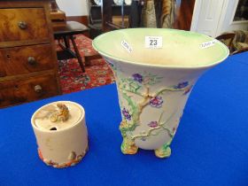 A Clarice Cliff vase and Honey pot, a.