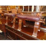 A pair of leather upholstered Camel stools