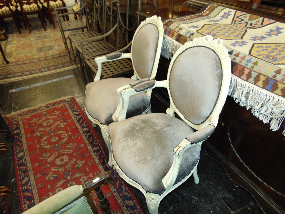 A pair of salon elbow chair