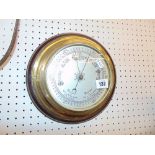 A brass and mahogany framed wall barometer